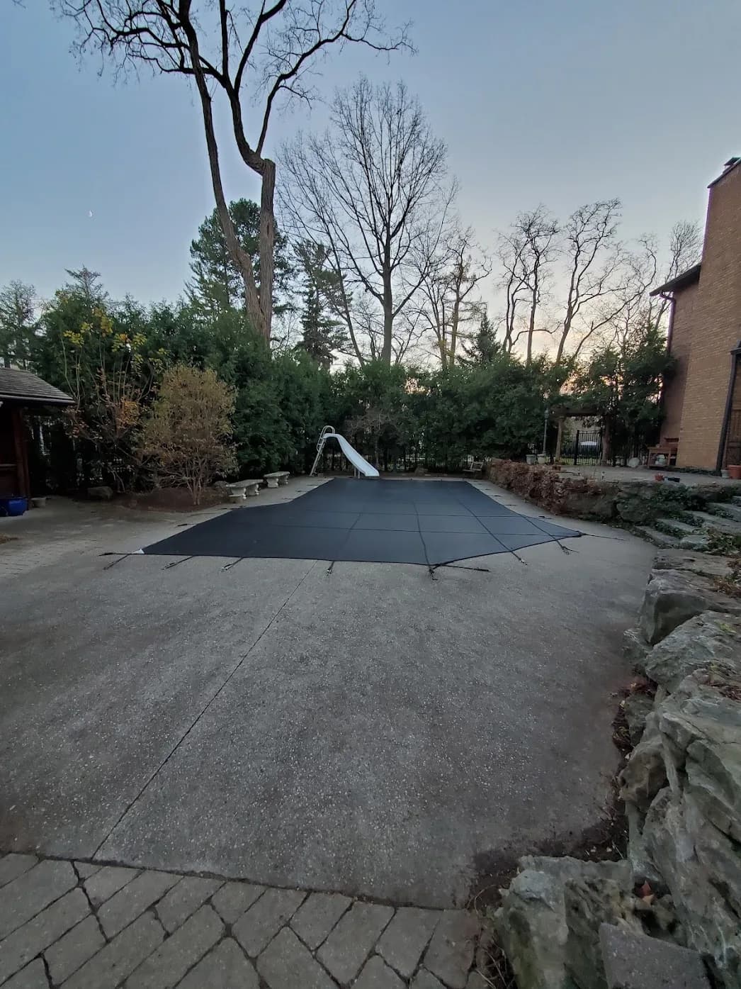 After fall yard clean up in Hamilton with the pool area cleared of leaves by Homegrown Property Enhancement
